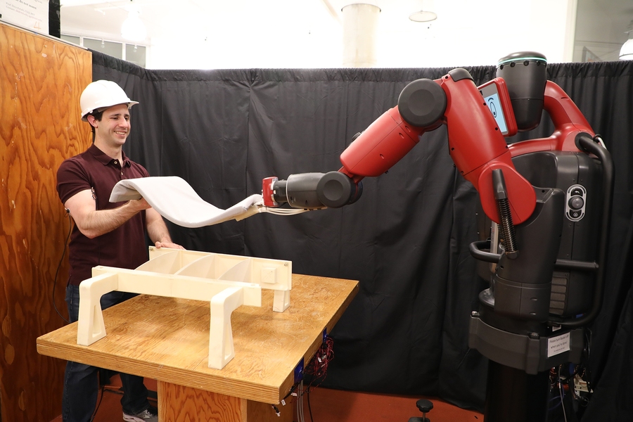 Revolutionary AI Robot Lifts Objects Through Bicep Muscle Monitoring Technology
